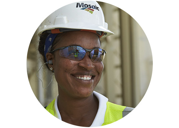 Close-up of woman in PPE smiling